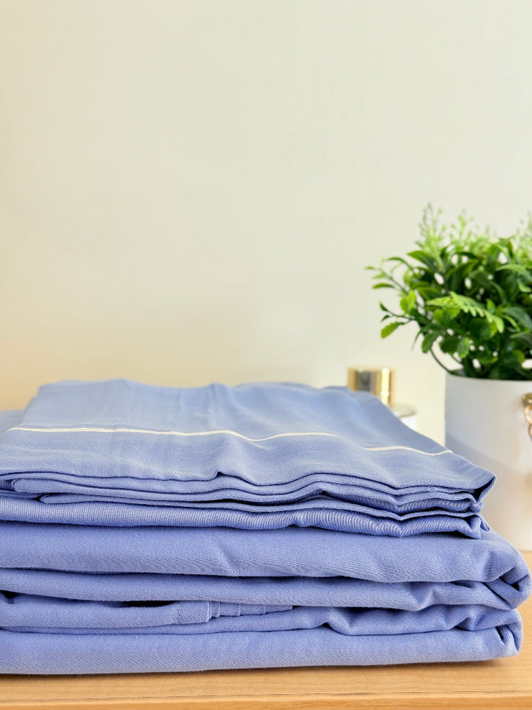 Cornflower Blue Solid Bedsheet with White Piping Border on Pillow Covers